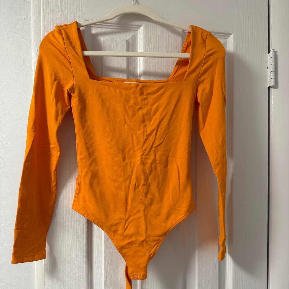 Orange Babaton long sleeve square neck bodysuit #bodysuit